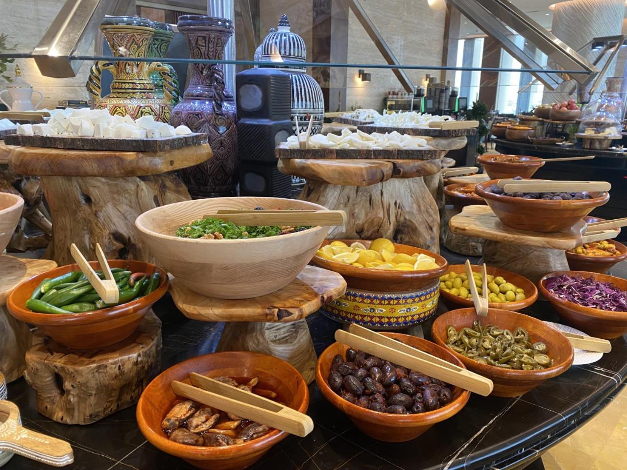 Movenpick Hotel And Residences Riyadh Ngoại thất bức ảnh A selection of tapas at a buffet